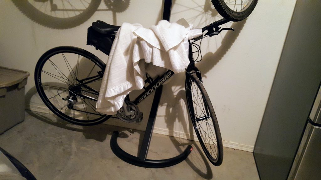 The Cannondale under a blanket.